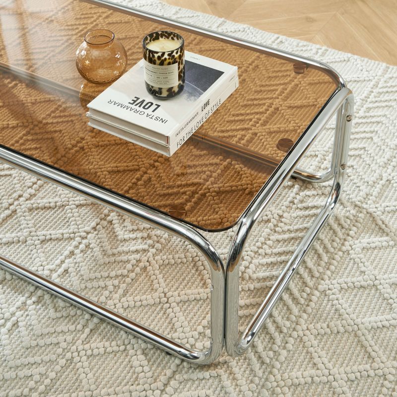 Table basse MAGGY verre trempé orange foncé structure en chrome