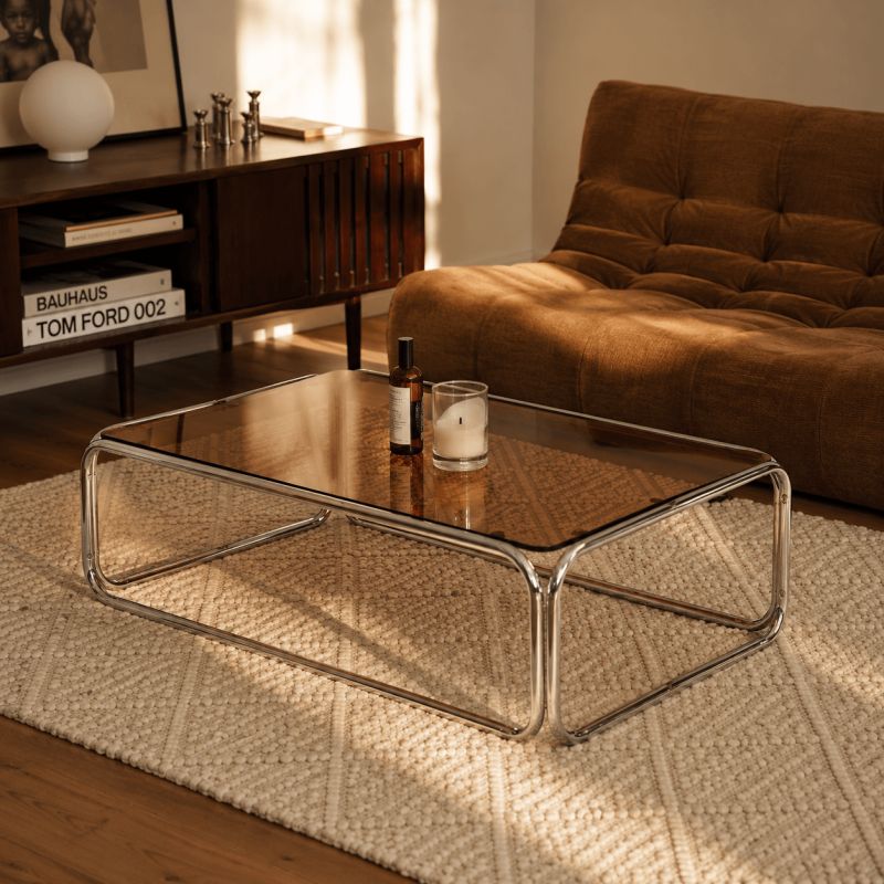 Table basse MAGGY verre trempé orange foncé structure en chrome
