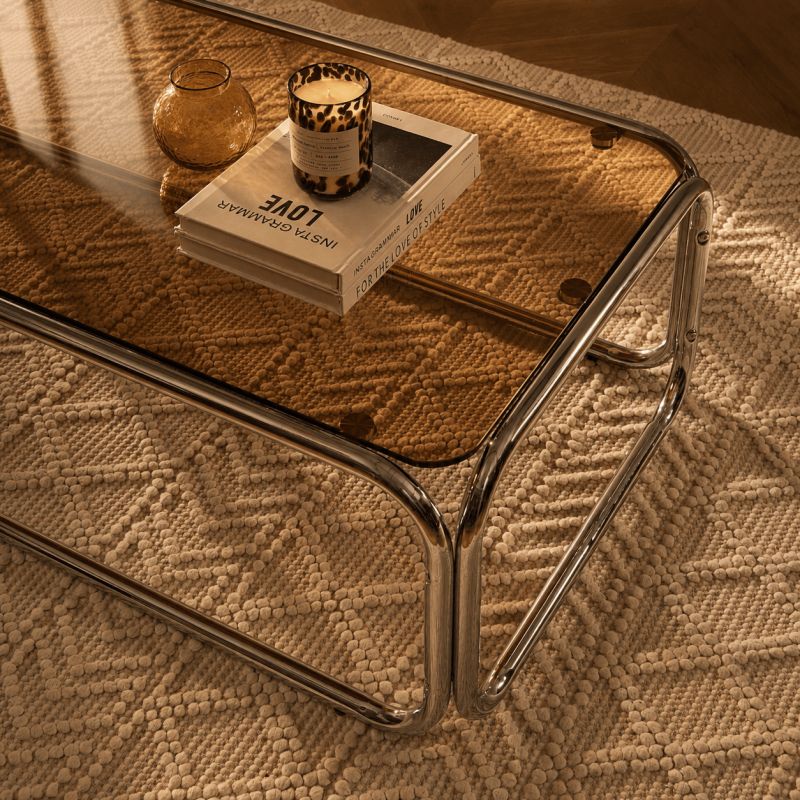 Table basse MAGGY verre trempé orange foncé structure en chrome
